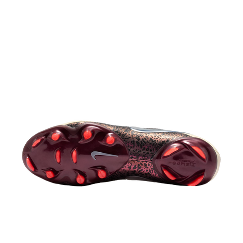 Soleplate view of a Nike Tiempo soccer cleat featuring a dark burgundy base with bright orange studs and a metallic bronze leopard-print pattern on the upper, set against a solid black background.