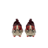 A rear view of a pair of soccer cleats featuring a bold leopard-print pattern in red, black, and cream. The cleats have maroon heel collars with pull tabs and bright red studs on the sole, set against a solid black background.