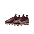 A three-quarter view of a pair of burgundy Nike soccer cleats with a silver swoosh and leopard-print heel details, set against a black background. The cleats have cream soles with bright red studs.