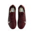 A top-down view of a pair of burgundy Nike soccer cleats against a black background. The cleats feature maroon laces and a white Nike swoosh with a red outline on the sides.