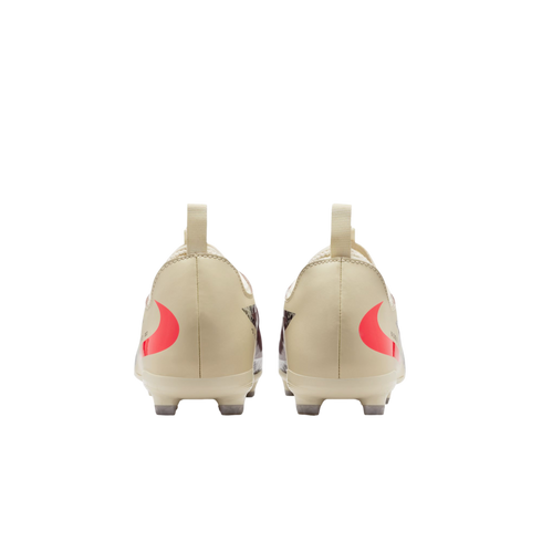 The rear view of two cream-colored soccer cleats with red swooshes on the heels and a black background.