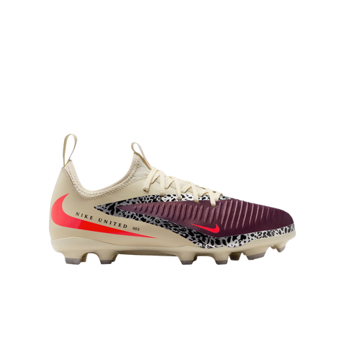 A side profile of a cream-colored Nike soccer cleat set against a solid black background. The shoe features a ridged burgundy toe box, a black-and-white leopard print accent stripe, and bright neon red swoosh logos. The side of the heel displays the text
