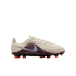 Profile view of a cream-colored Nike soccer cleat against a solid black background. The shoe features a purple leopard-print side panel, a metallic silver swoosh, and bright orange studs. The text "NIKE UNITED 003" is printed near the toe.