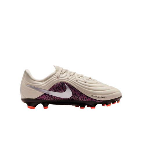 A profile view of a Nike soccer cleat against a black background. The shoe features an off-white textured upper with wave-like ridges, a silver Nike swoosh, and a purple and black patterned side panel. The name ".P. GUIJARRO." is printed near the toe, and