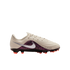 A profile view of a Nike soccer cleat against a black background. The shoe features an off-white textured upper with wave-like ridges, a silver Nike swoosh, and a purple and black patterned side panel. The name ".P. GUIJARRO." is printed near the toe, and