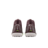 Rear view of purple Nike Mercurial soccer cleats with white studded soles and "Zm Air" branding on the heels, set against a black background.
