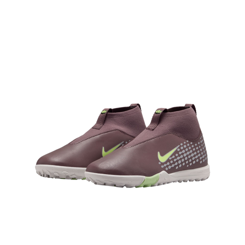 Dark purple Nike mid-cut turf soccer shoes with lime green swooshes and grey dot accents, against a black background.