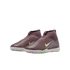 Dark purple Nike mid-cut turf soccer shoes with lime green swooshes and grey dot accents, against a black background.
