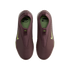 Top-down view of a pair of maroon slip-on Nike shoes featuring lime green swooshes and KM branding on the insoles.