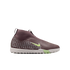 Profile view of a maroon Nike laceless soccer shoe with a light green swoosh and white textured sole against a black background.