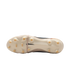 Underside of a cream-colored Nike Tiempo soccer cleat with gold studs, featuring a black swoosh in the center and embossed branding on the heel.