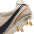A close-up view of the heel and sole of an off-white leather soccer cleat. The shoe features a dark blue stripe with white stitching and five decorative, curved rows of stitching in a red, orange, and yellow gradient. The glossy white sole plate has trans