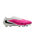 A low-cut Nike soccer cleat with a hot pink textured front, white heel, and black Nike swooshes, presented on a white background.