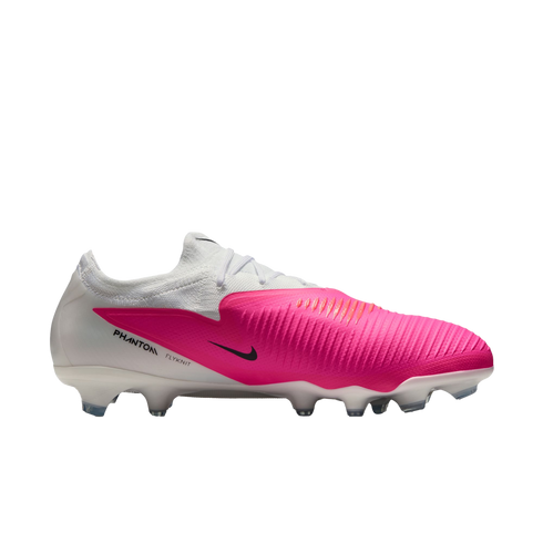 A Nike Phantom Venom soccer cleat in a white and vibrant pink colorway with a black Nike swoosh.