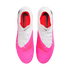 Top-down view of a pair of Nike Phantom soccer cleats featuring a white upper, a bright pink textured forefoot, and white laces against a plain white background.