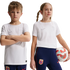 Two children in white Nike soccer jerseys and blue pants with Norway national team crests. The girl holds a soccer ball against a black background.