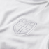 Close-up of a white textured jersey with a tonal, white-on-white embroidered crest. The shield-shaped badge features a cross and the word "NORGE" at the top.