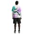 A back view of a person standing against a solid black background, wearing a black beanie, a colorful graphic t-shirt layered over a white long-sleeved shirt, black shorts, and grey sneakers.
