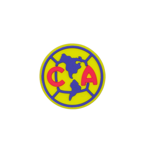 A circular yellow Soccer Croc Charm featuring the blue and red Club América football team logo.