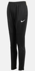 Black Nike training pants featuring a white swoosh logo on the left thigh, an elastic waistband, and a tapered fit with seam details below the knee.