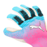 A close-up shot of a Puma goalkeeper glove featuring a vibrant pink and blue gradient design with black textured grip accents on the fingers and a white Puma logo.