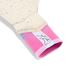 Close-up of a goalie glove showing a pink knit strapless cuff with a white "TR" logo and a cream-colored, black-speckled latex palm.