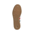 Textured tan gum rubber outsole of an Adidas sneaker featuring an intricate tread pattern and logo.