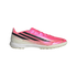 Vibrant pink and white athletic turf shoe with three bold black diagonal stripes, gold detailing, and "HYPERFAST" text on the side.