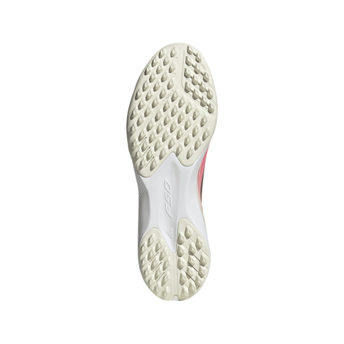 Sole of an off-white F50 turf soccer shoe featuring numerous small rubber studs and a central white bridge with the F50 logo on a plain white background.