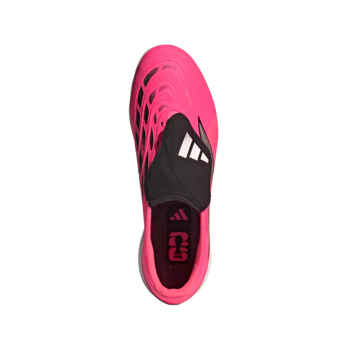 Top-down view of a bright pink Adidas soccer cleat with a black laceless shroud and white logo, set against a white background.