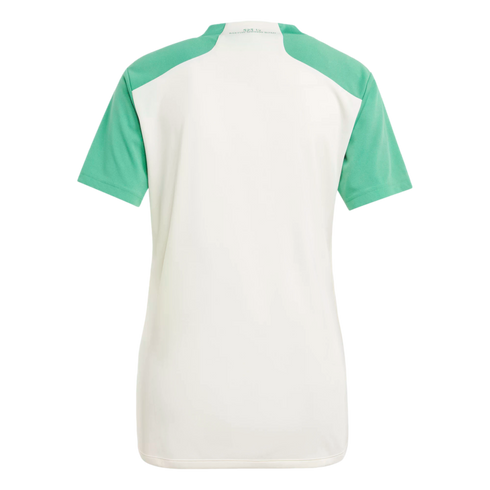 Back view of a white sports shirt featuring bright green short sleeves and shoulder panels on a solid black background. Small text is printed on the back neck.