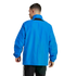 Rear view of a man wearing a bright blue athletic jacket and black striped track pants against a white background.