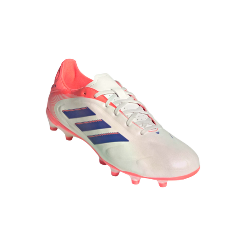 White Adidas soccer cleat with pink accents on the heel and sole, featuring three navy blue stripes on the side, displayed against a solid black background.