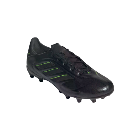 Black Adidas Copa soccer cleat with neon green stripes on the side and studs, shown from a side angle against a black background.