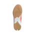 The textured tan gum rubber outsole of an Adidas indoor sports shoe, showing intricate grip patterns and white and peach accents on the midfoot.