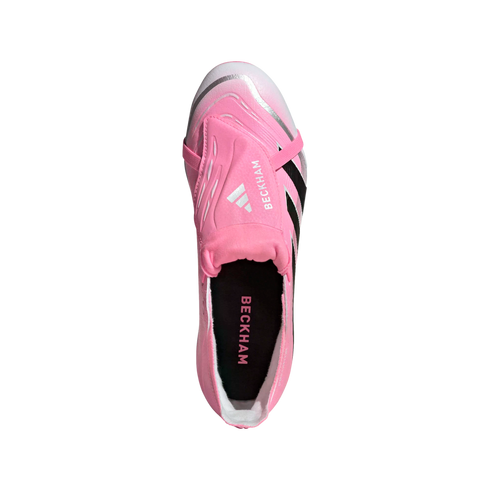 Top-down view of a pink Adidas soccer cleat with "BECKHAM" on the fold-over tongue. It features silver accents and black stripes.