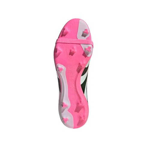 Bottom view of a pink and white Adidas Predator soccer cleat sole with triangular studs and embossed 'PREDATOR' text on a black background.