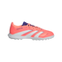 A coral Adidas Predator turf soccer shoe with white stripes, purple accents, and a white rubber studded sole, isolated on a black background.