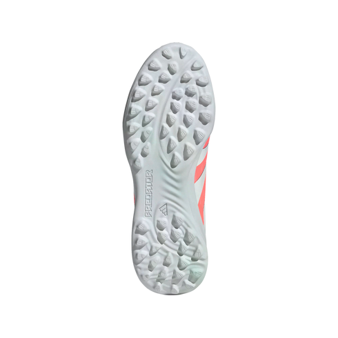 The sole of a white Adidas Predator turf shoe, featuring numerous small studs and embossed branding.