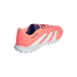 A salmon pink and white Adidas Predator turf soccer shoe, shown from a rear three-quarter angle against a solid black background.