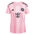 A pink Inter Miami CF home jersey by Adidas featuring the team crest, Royal Caribbean logo, and signature black three-stripes on the shoulders.
