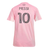 The back of a pink soccer jersey with "MESSI" and the number "10" in black. "FREEDOM TO DREAM" is printed on the upper back.