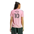Rear view of a person wearing a pink Inter Miami soccer jersey with "MESSI 10" on the back and dark cargo pants against a white background.