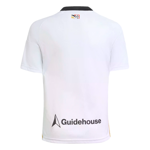 Back view of a white short-sleeve soccer jersey featuring a black collar, a small colorful crest near the neck, and a Guidehouse logo with a triangular icon at the bottom.