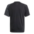 Back view of a black short-sleeved athletic shirt with "FREEDOM TO DREAM" printed in small grey text below the collar.