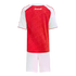 Back view of an Arsenal kids' football kit featuring a red patterned jersey with white sleeves and "Arsenal" script on the upper back, paired with white shorts.