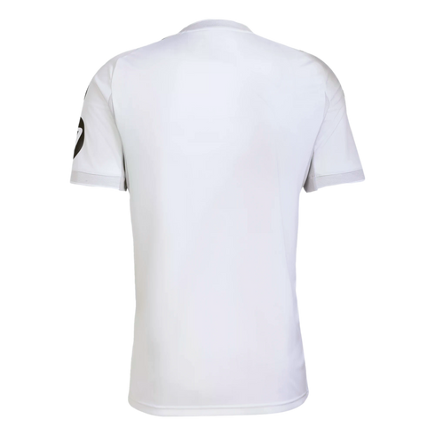 Rear view of a plain white short-sleeved athletic t-shirt with a small black logo on the left sleeve.