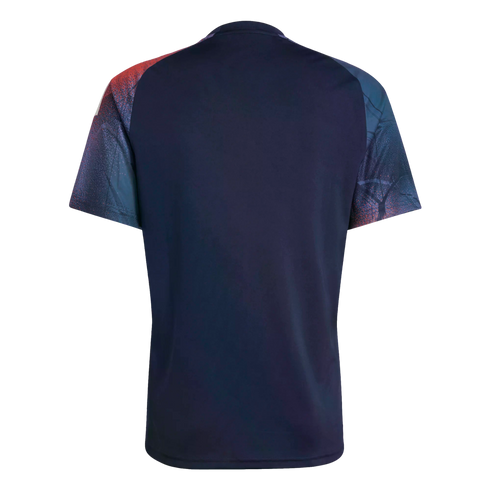 Back view of a navy blue short-sleeved jersey with red and blue abstract patterned raglan sleeves against a black background.