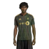 A man with dreadlocks wears a black and gold LAFC soccer jersey with a geometric pattern against a solid black background.