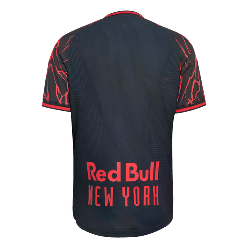Rear view of a dark gray soccer jersey with red lightning-patterned sleeves and "Red Bull NEW YORK" printed in bold red text on the lower back.